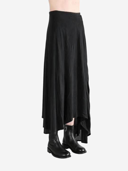 Black dress worn by a person, showing the dress' fit