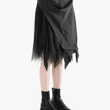Black dress worn by a person, showing the dress' fit