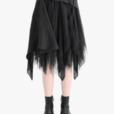Black dress worn by a person, showing the dress' fit