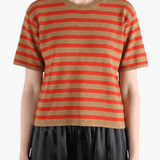 Brown t-shirt worn by a person, showing the t-shirt fit
