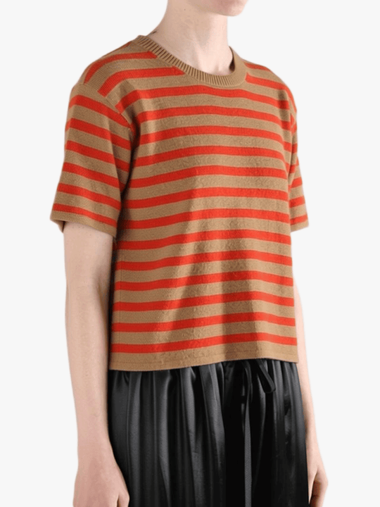 Brown t-shirt worn by a person, side view