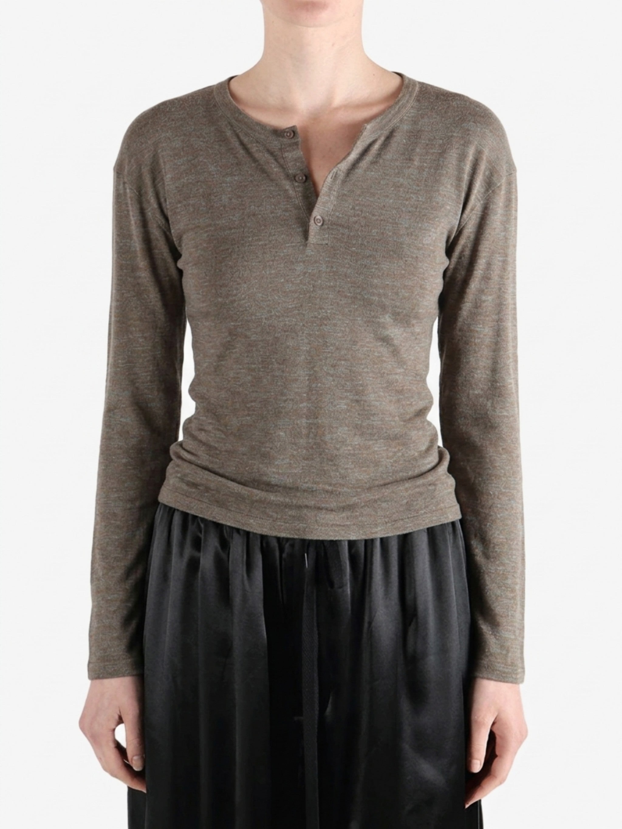 Grey knitwear worn by a person, showing the knitwear fit