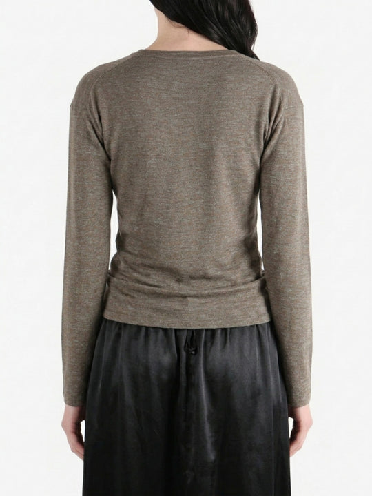Grey knitwear worn by a person, back view