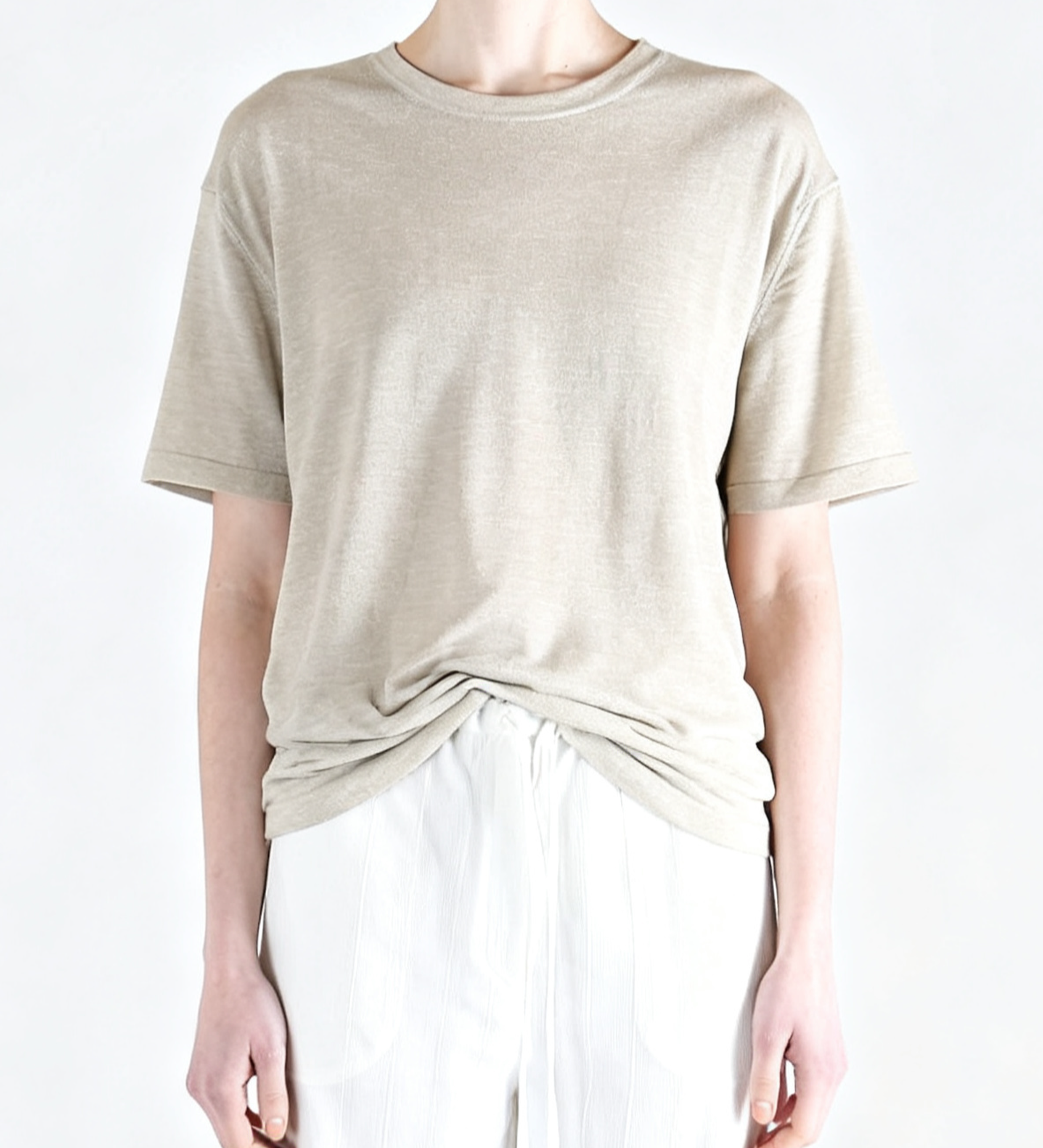 White t-shirt worn by a person, showing the t-shirt fit