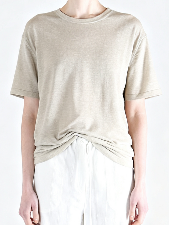 White t-shirt worn by a person, showing the t-shirt fit