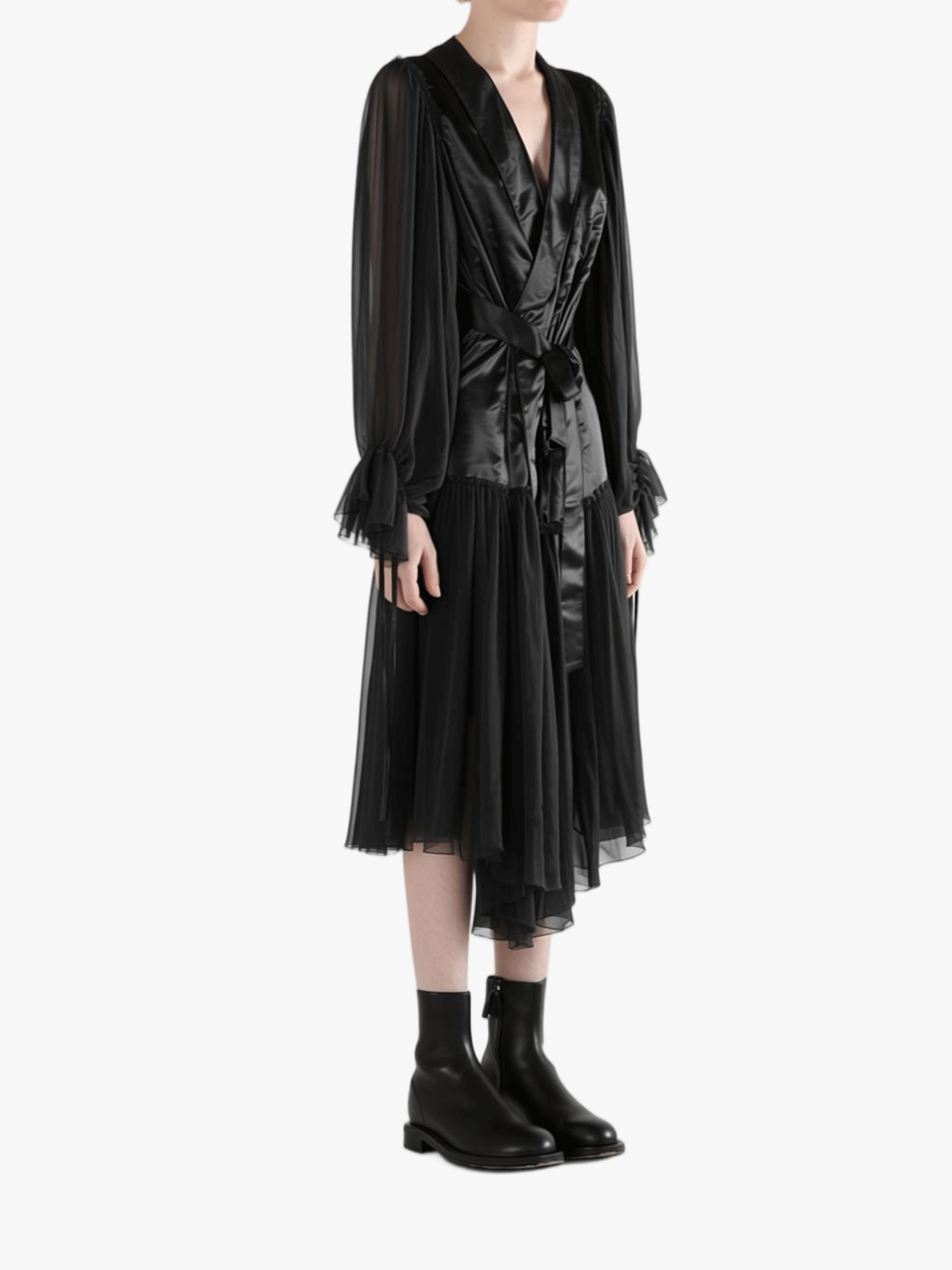 Black dress worn by a person, showing the dress's fit