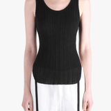 Black top worn by a person, showing the top fit