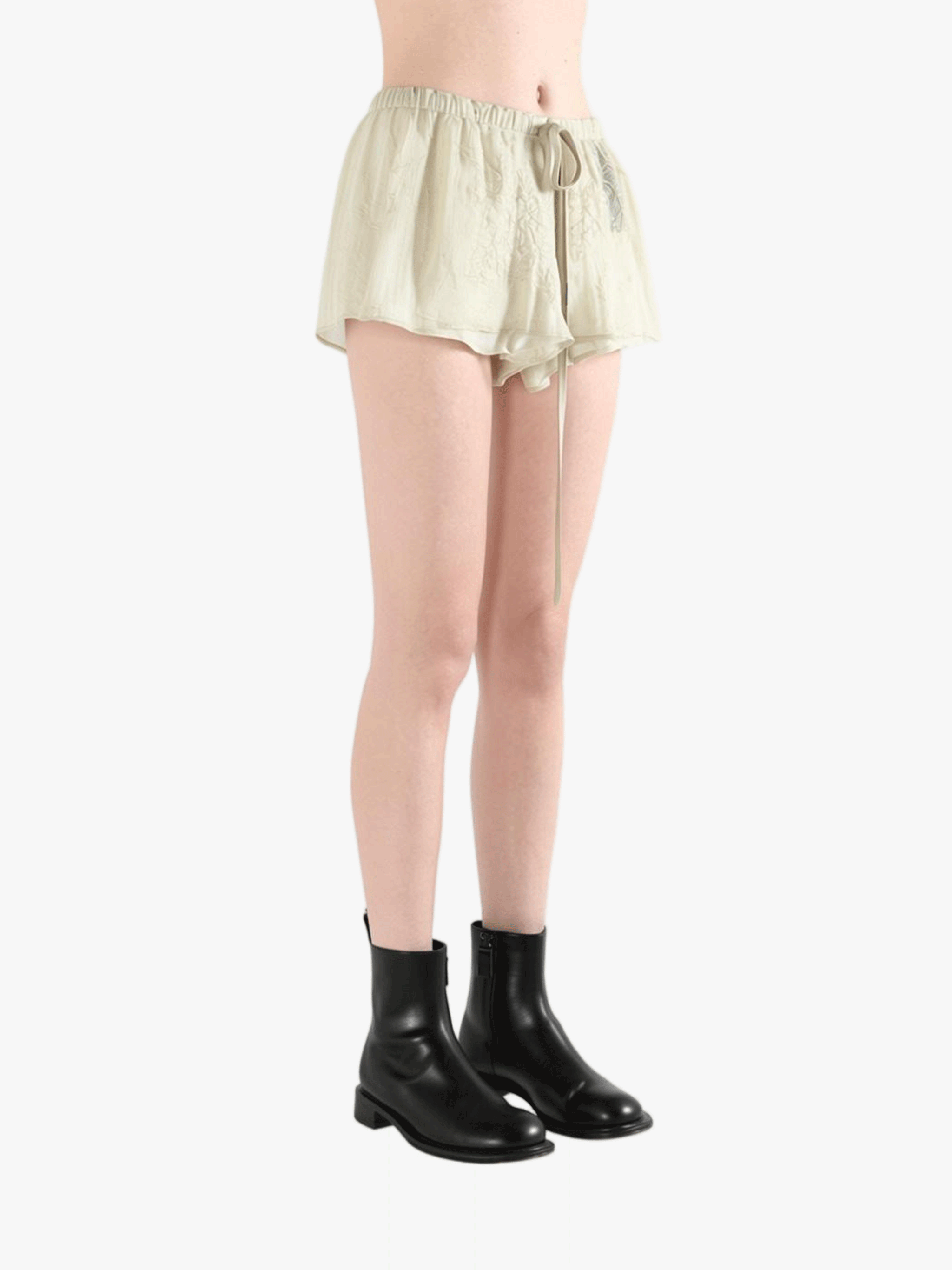 Tan shorts worn by a person, showing the shorts' fit 