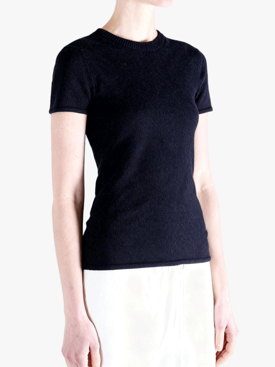 Black t-shirt worn by a person, side view