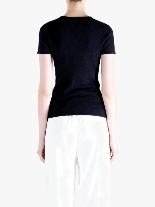 Black t-shirt worn by a person, back view