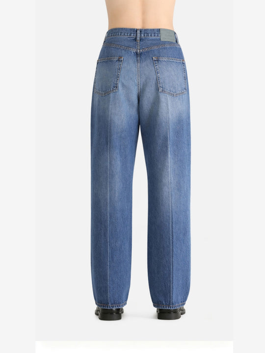 Blue jeans worn by a person, showing the jeans fit
