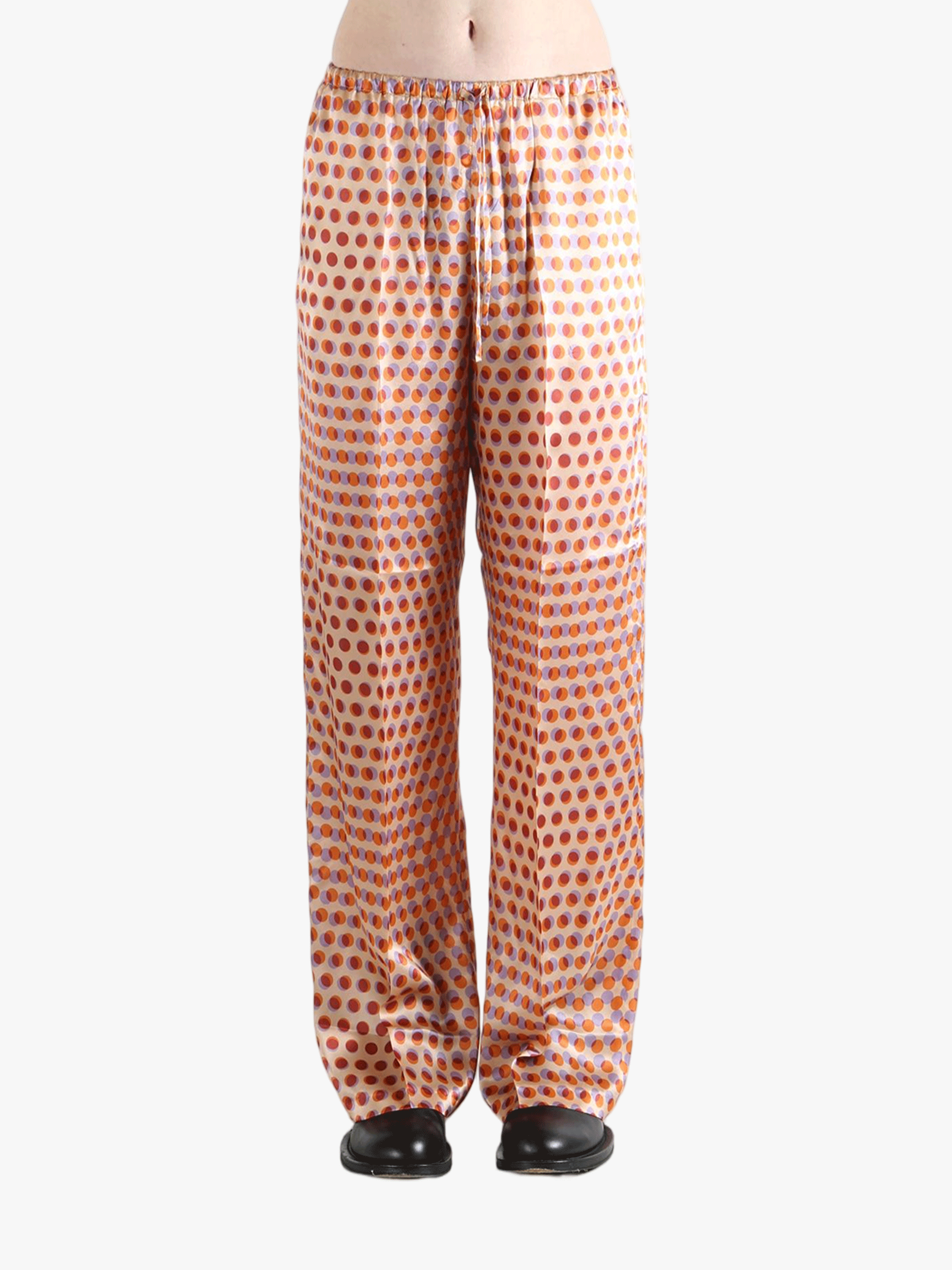 Brown pant worn by a person, showing the pant's fit