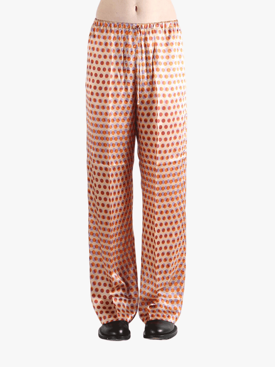 Brown pant worn by a person, showing the pant's fit