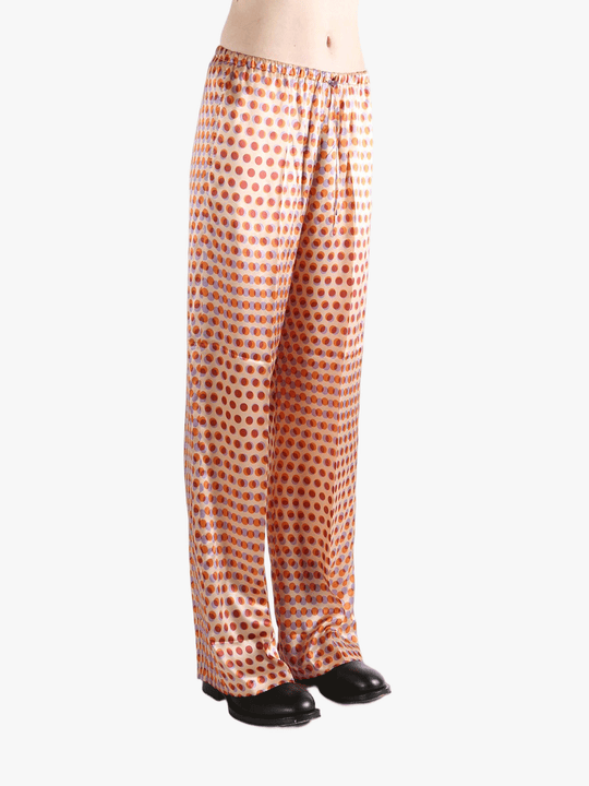 Brown pant worn by a person, showing the pant's fit