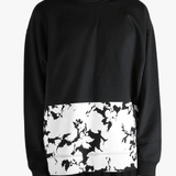 Black sweatshirt worn by a person, showing the sweatshirt's fit