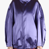 Purple jacket worn by a person, showing the jacket fit