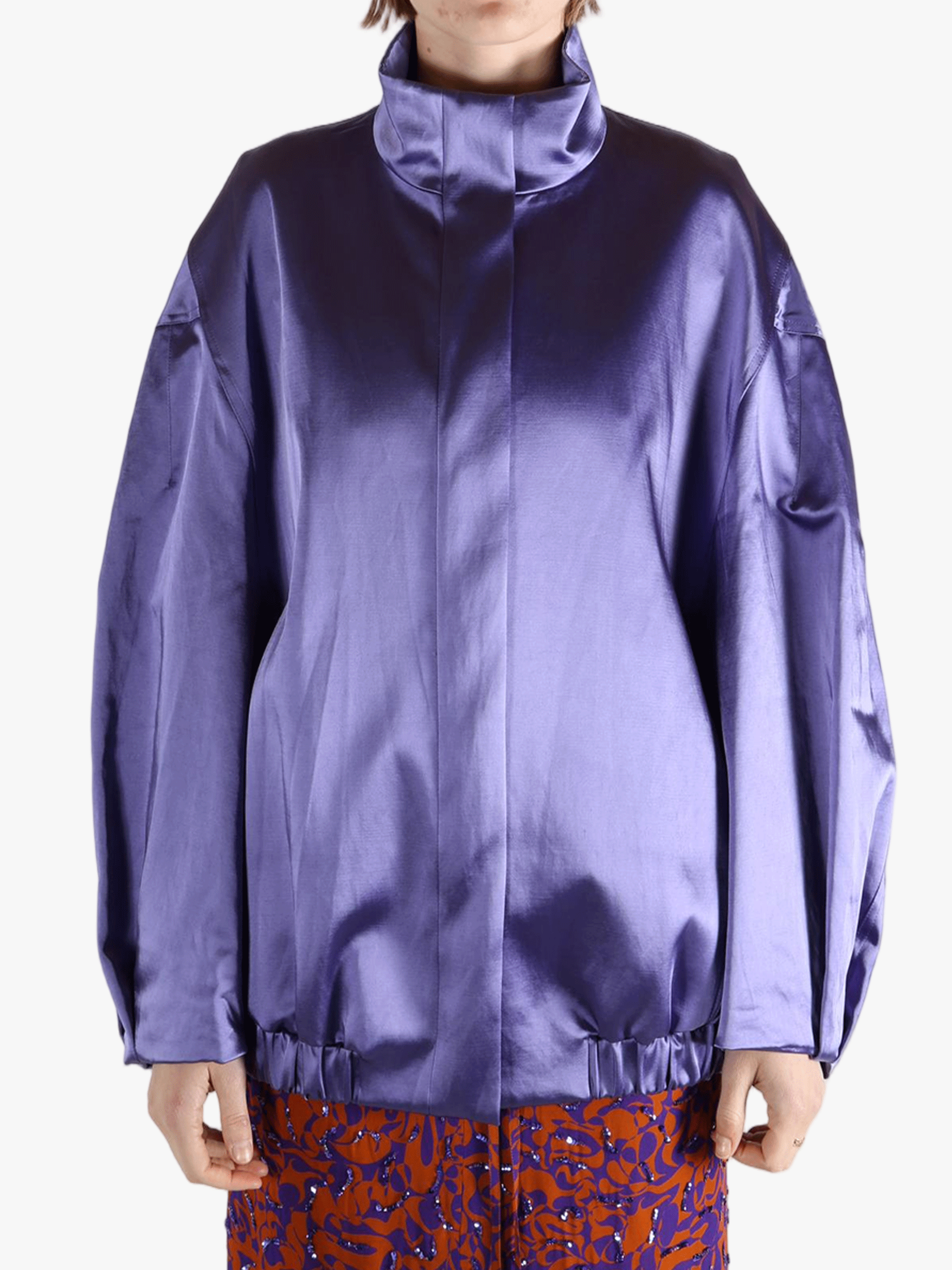 Purple jacket worn by a person, showing the jacket fit