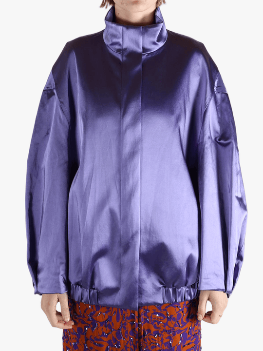 Purple jacket worn by a person, showing the jacket fit