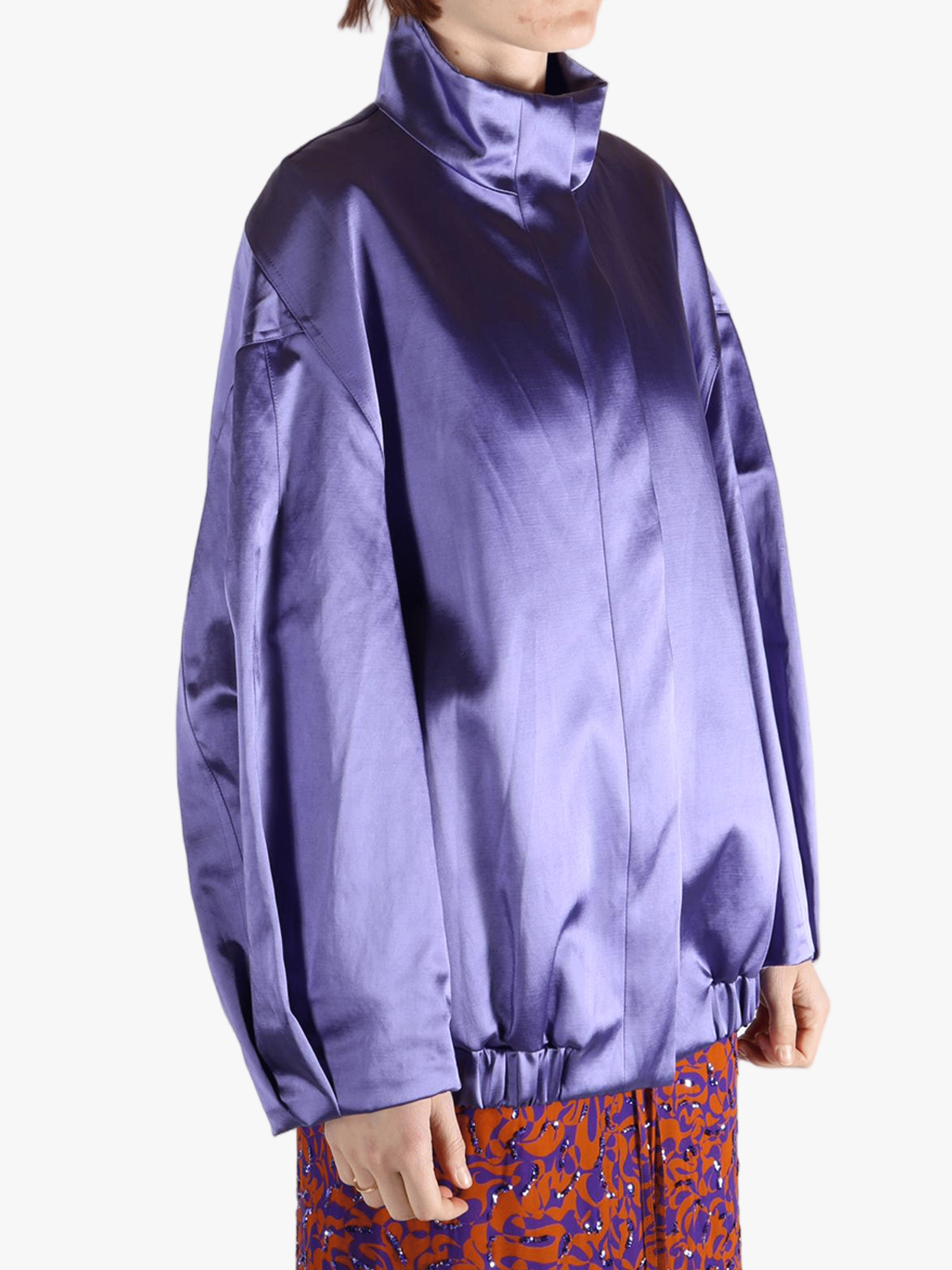 Purple jacket worn by a person, showing the jacket fit