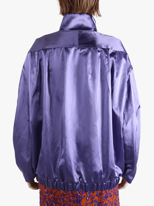 Purple jacket worn by a person, showing the jacket fit