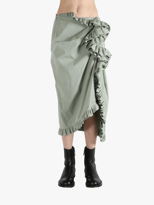 Green dress worn by a person, showing the dress's fit