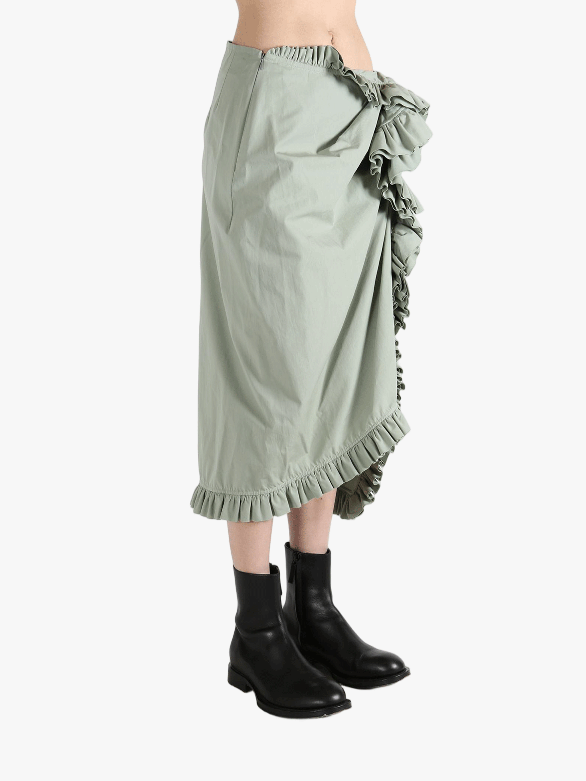 Green dress worn by a person, showing the dress's fit