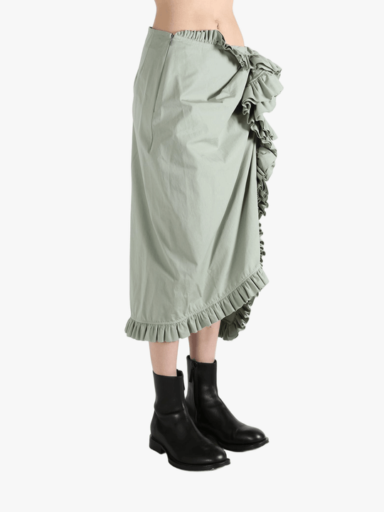 Green dress worn by a person, showing the dress's fit
