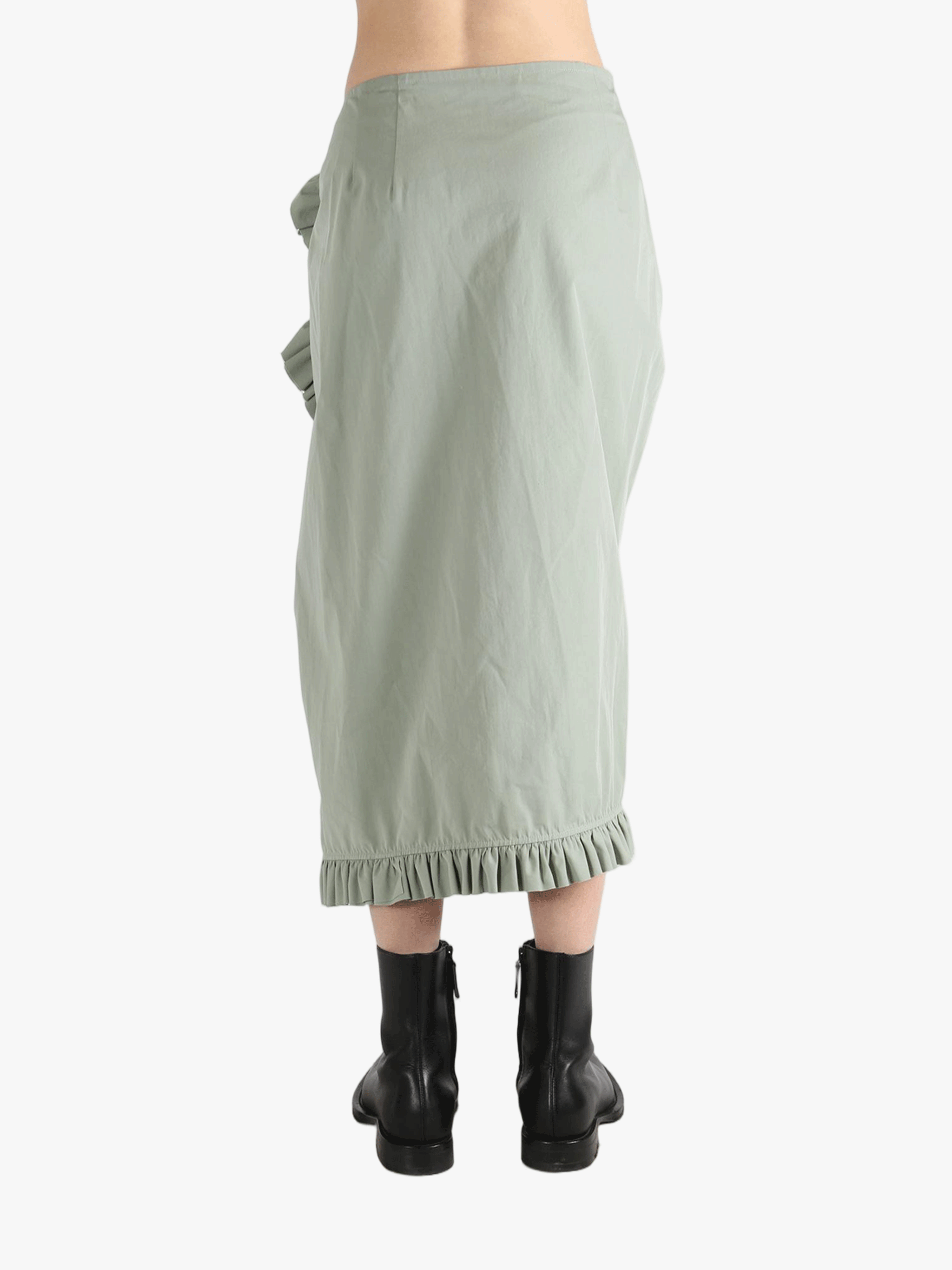 Green dress worn by a person, showing the dress's fit