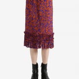 Red dress worn by a person, showing the dress's fit