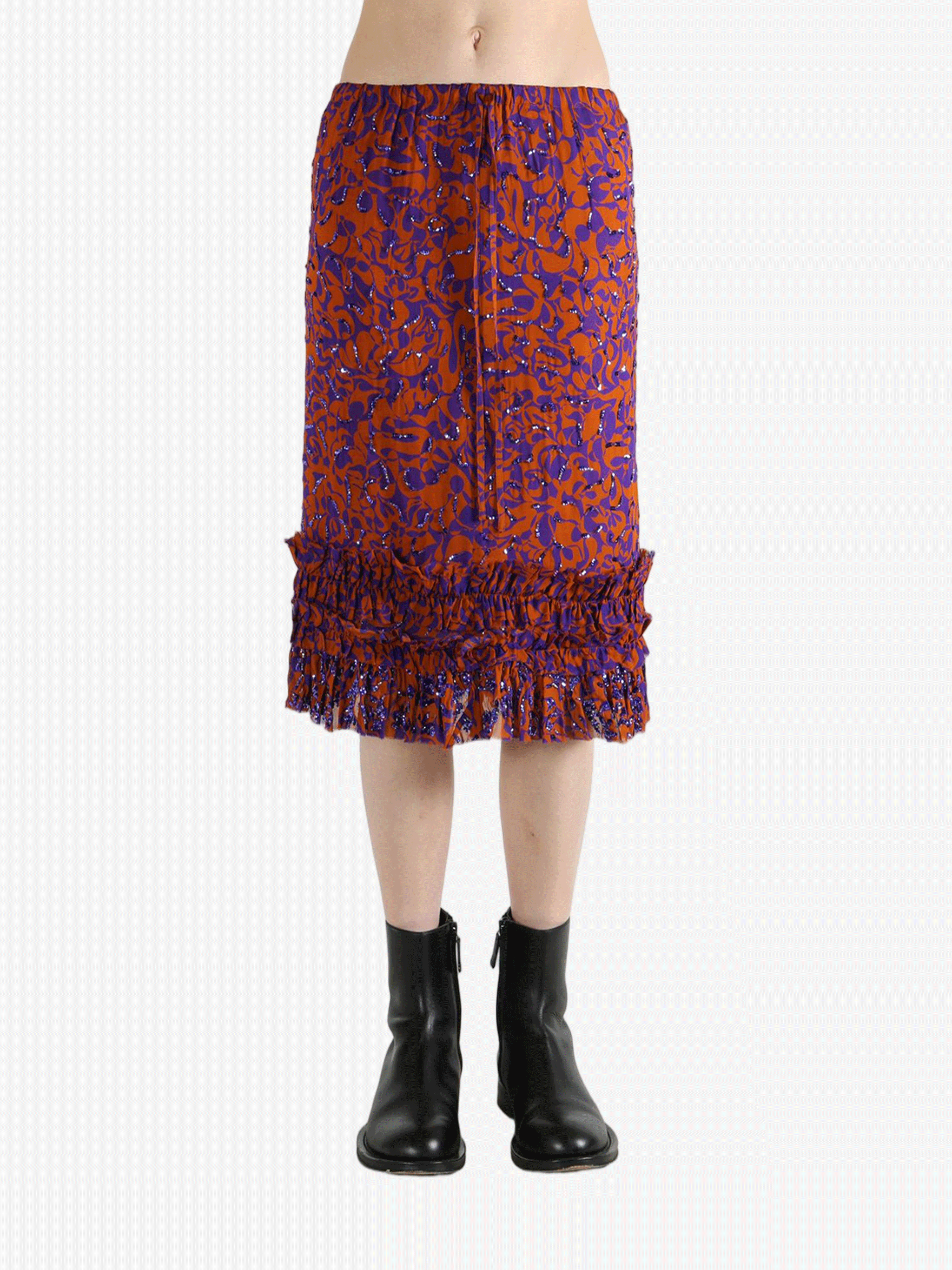 Red dress worn by a person, showing the dress's fit