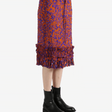 Red dress worn by a person, showing the dress's fit