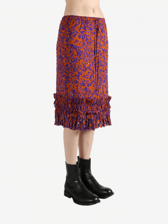 Red dress worn by a person, showing the dress's fit
