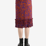 Red dress worn by a person, showing the dress's fit
