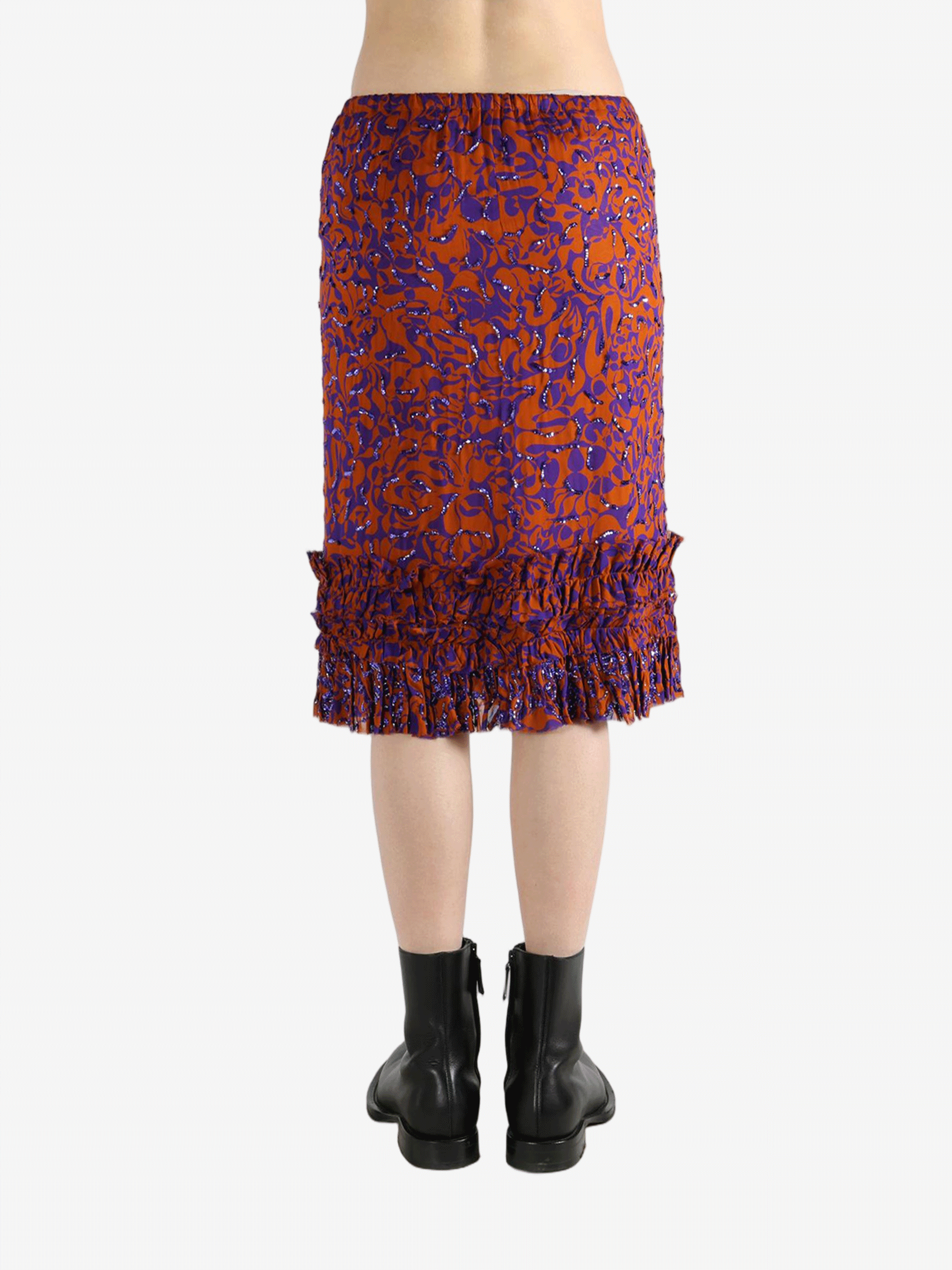 Red dress worn by a person, showing the dress's fit