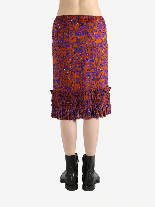 Red dress worn by a person, showing the dress's fit