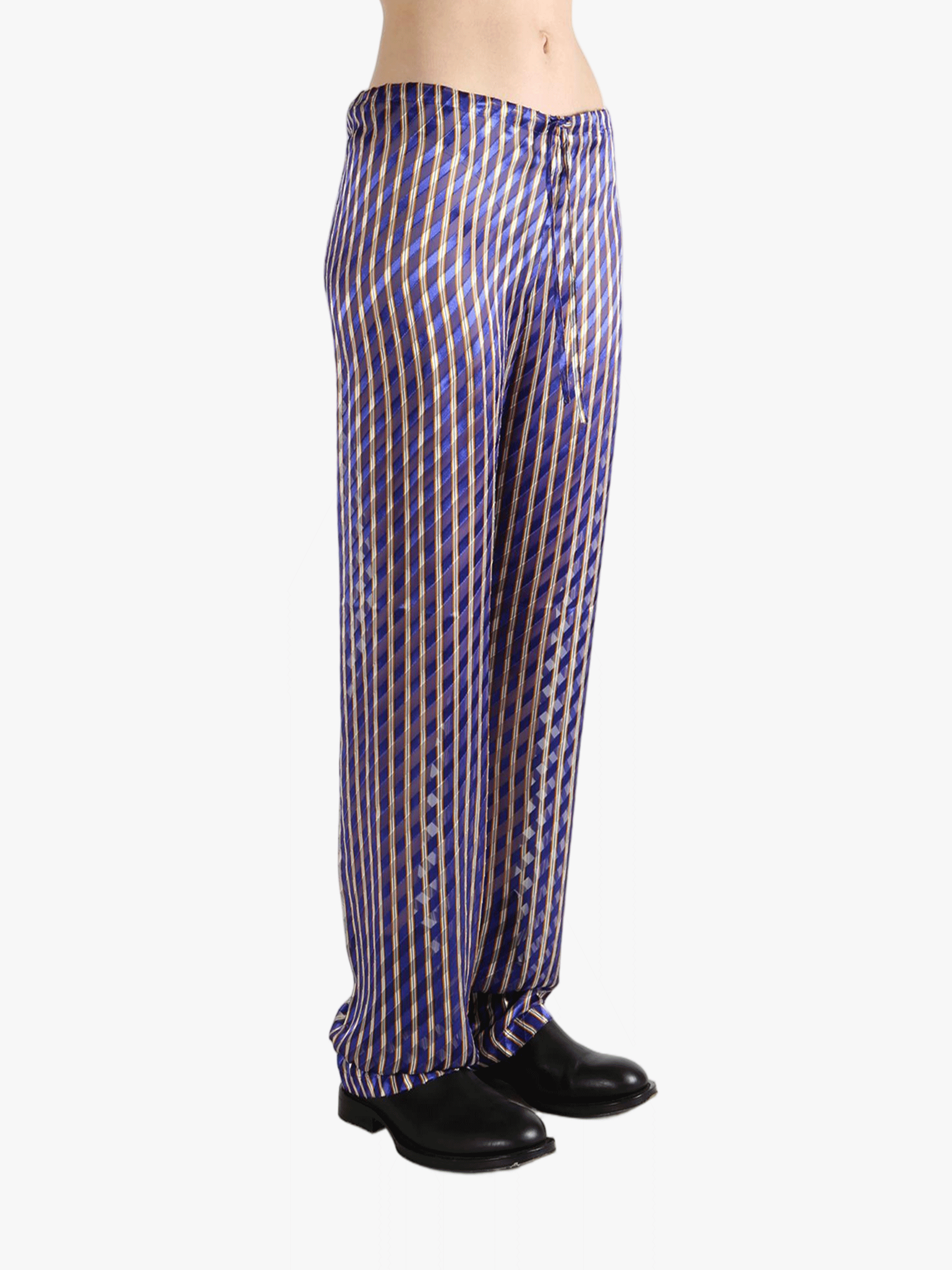 Purple pants worn by a person, showing the pants's fit