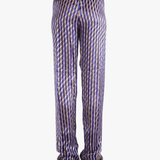 Purple pants worn by a person, showing the pants's fit