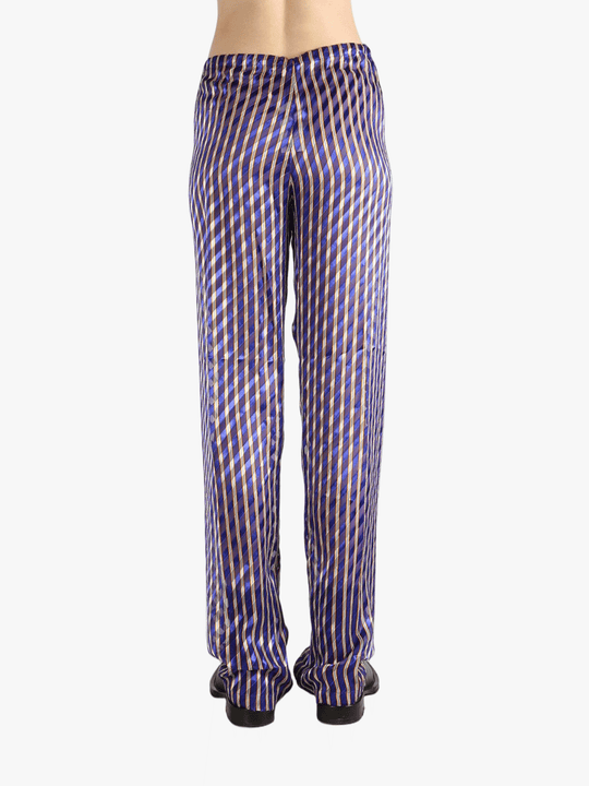 Purple pants worn by a person, showing the pants's fit