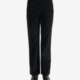 Black pants worn by a person, showing the pants fit