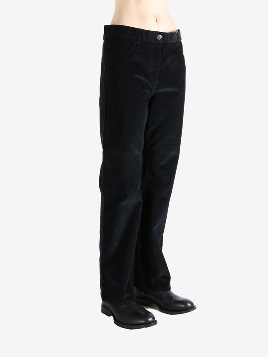 Black pants worn by a person, showing the pants fit