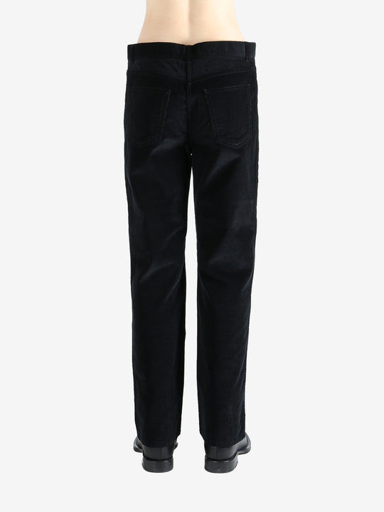 Black pants worn by a person, showing the pants fit