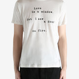 Ivory T-shirt worn by person, shoing the t-shirt fit