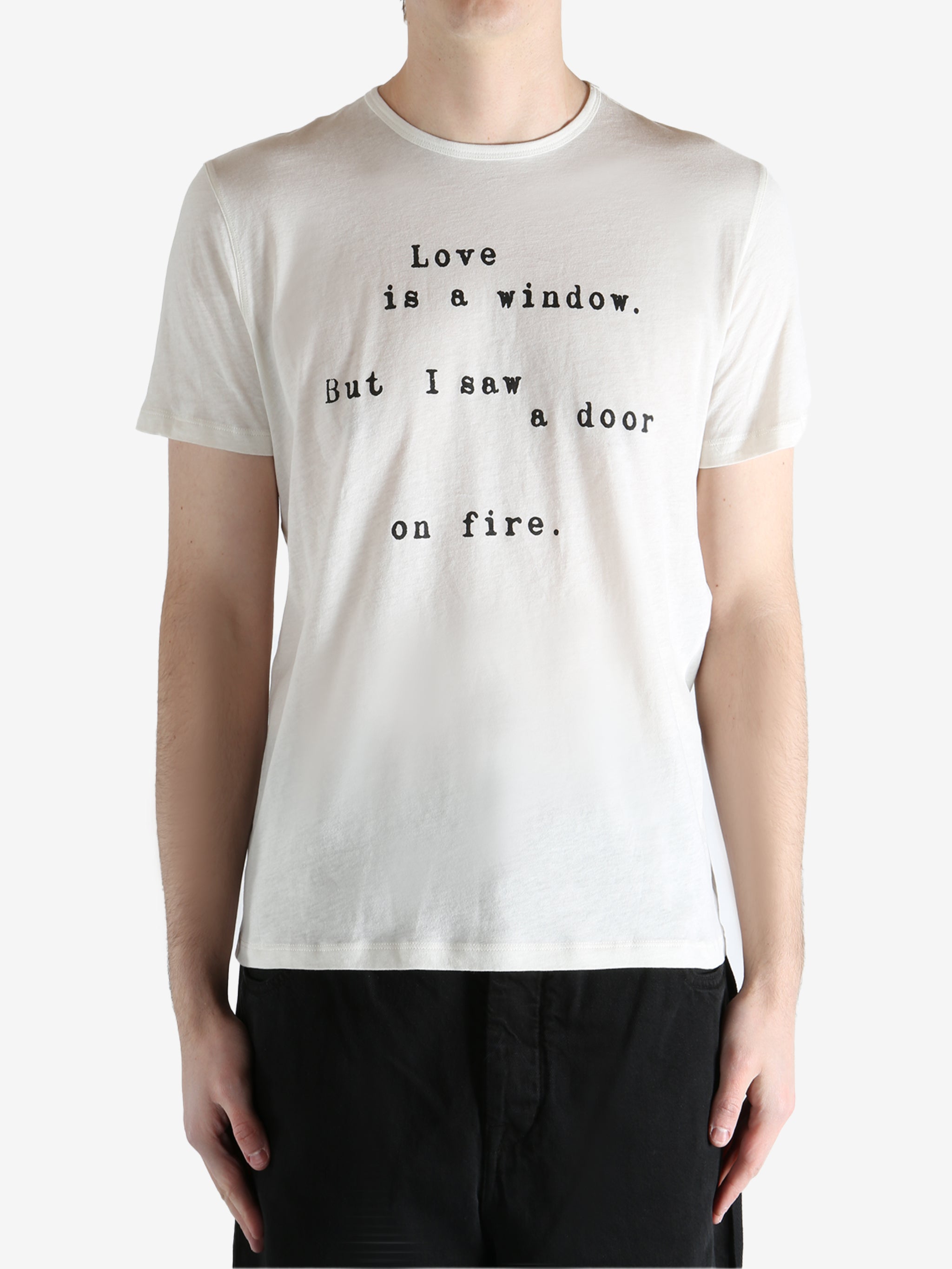 Ivory T-shirt worn by person, shoing the t-shirt fit