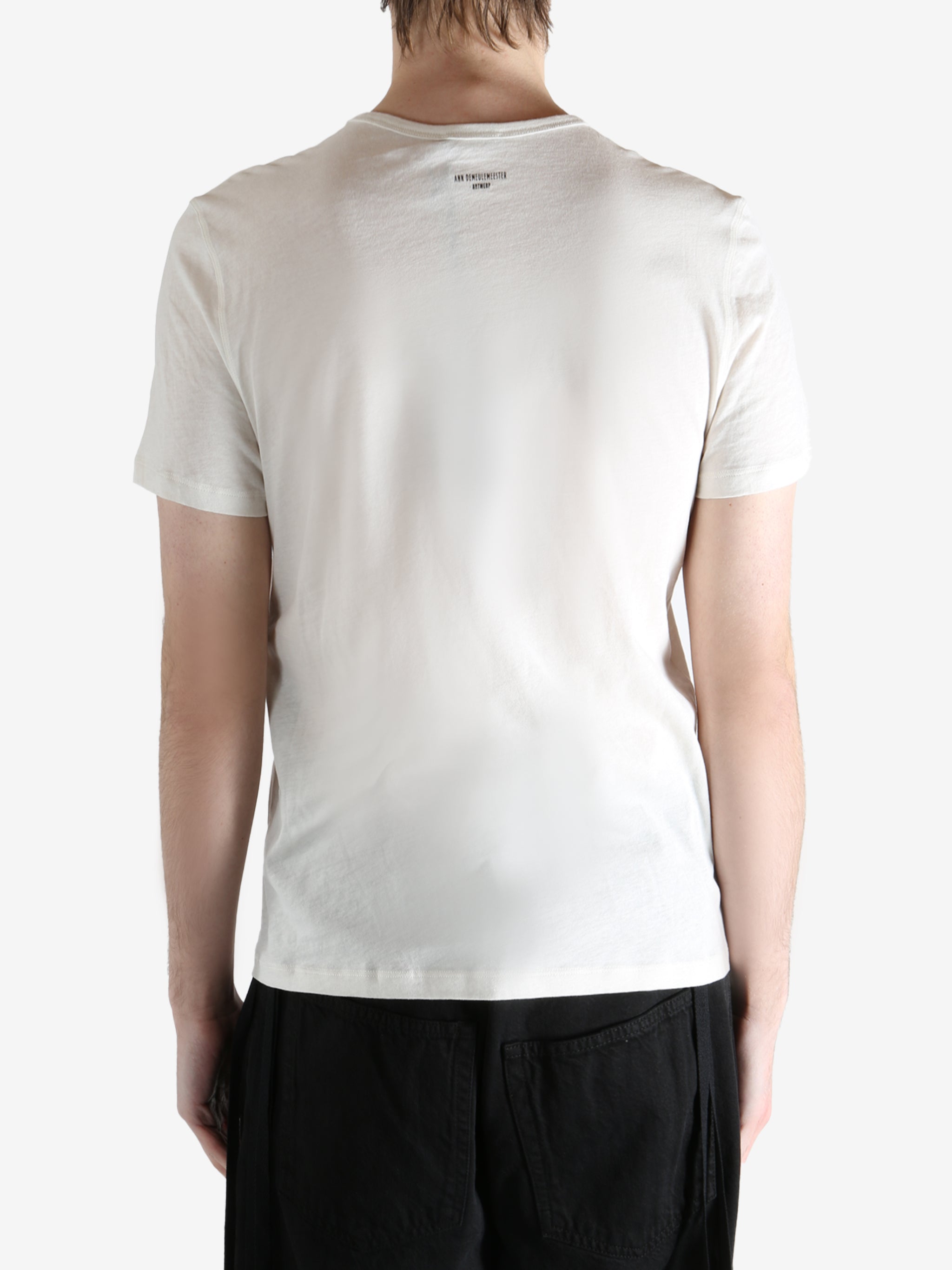 Ivory T-shirt worn by person, shoing the t-shirt fit