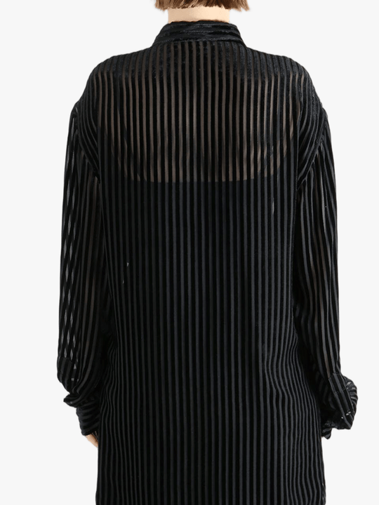 Black shirt worn by a person, showing the shirt's fit