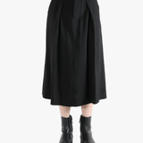 Black skirt worn by a person, showing the skirt's fit