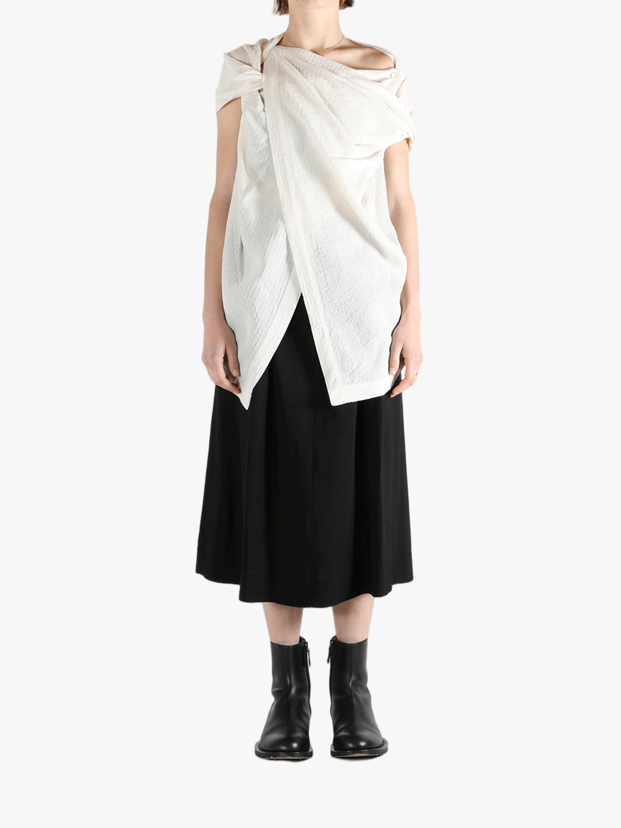 White top worn by a person, showing the top's fit