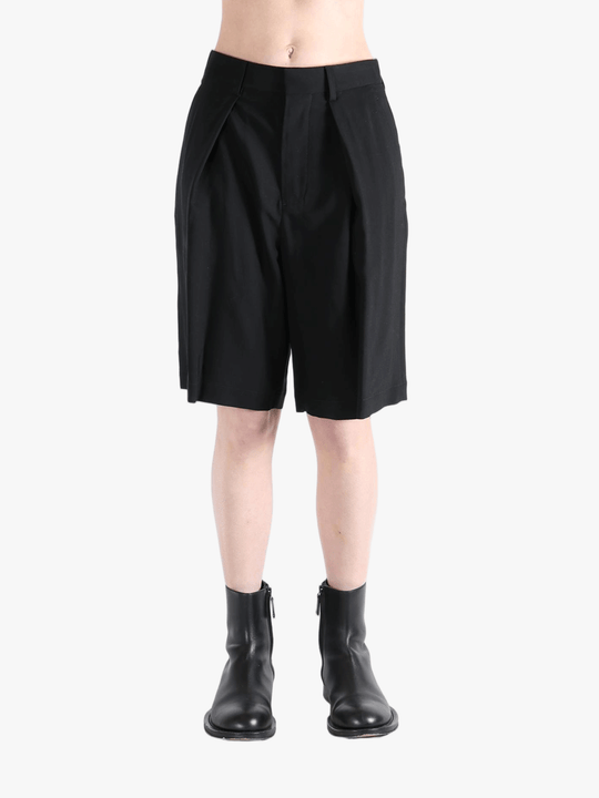 Black short worn by a person, showing the short's fit