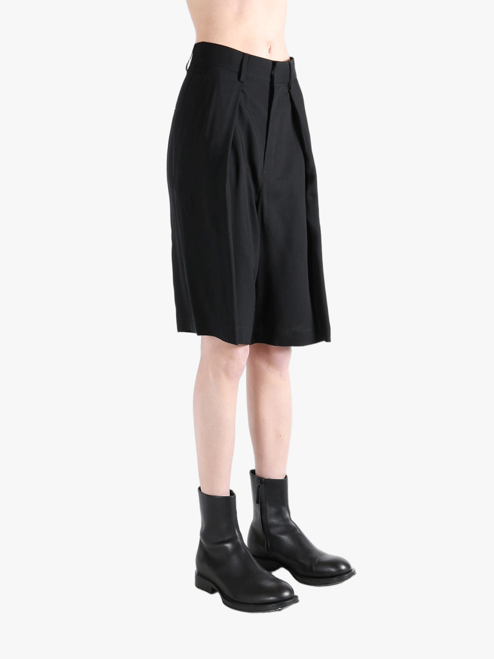 Black short worn by a person, showing the short's fit