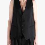 Black top worn by a person, showing the top's fit